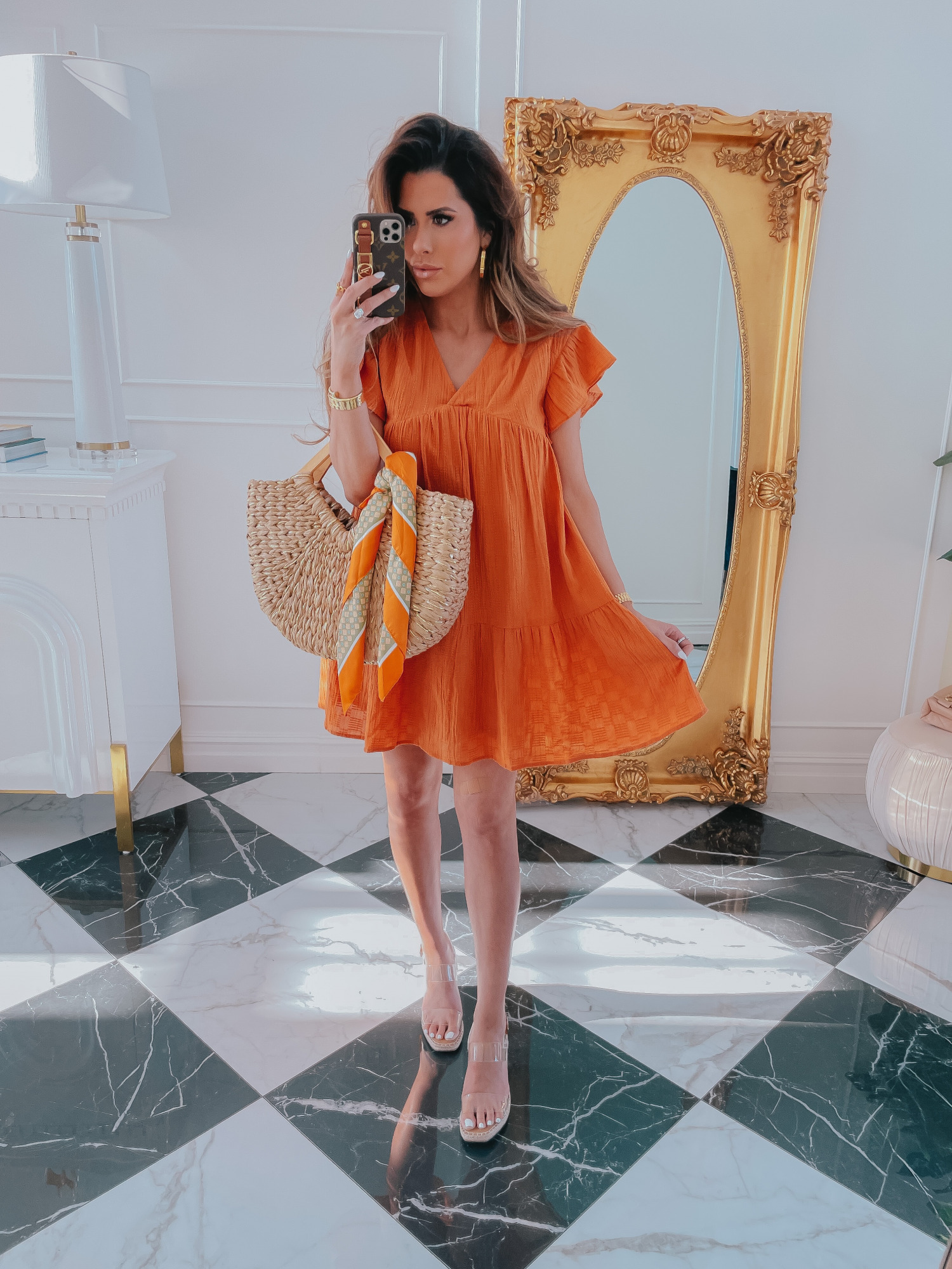 Casual Dress Spring 2021, Orange Dress, Flattering Dress, Flattering Wedges, Clear Wedges, Straw Beach Bag, Emily Gemma |Spring Fashion by popular US fashion blog, The Sweetest Thing: image of Emily Gemma wearing a Red Dress flutter sleeve orange baby doll dress and clear strap espadrilles. 