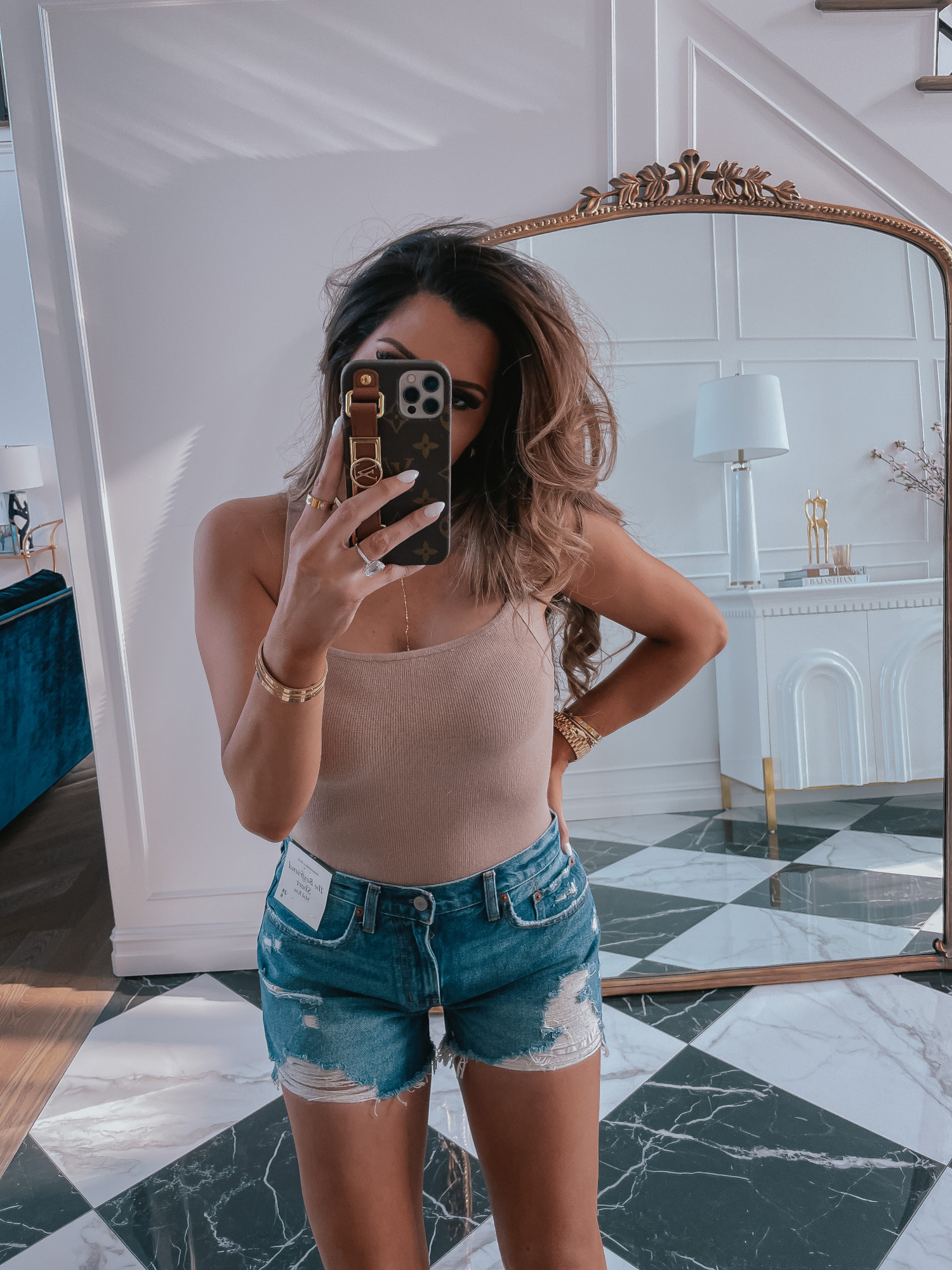 best Abercrombie shorts spring 2021, LTK day spring 2021, best high waisted denim shorts spring 2021, emily gemma1 |Best Sales This Weekend by popular US fashion blog, The Sweetest Thing: image of Emily Gemma wearing a nude bodysuit, cutoff denim shorts, and clear strap platform espadrilles. 