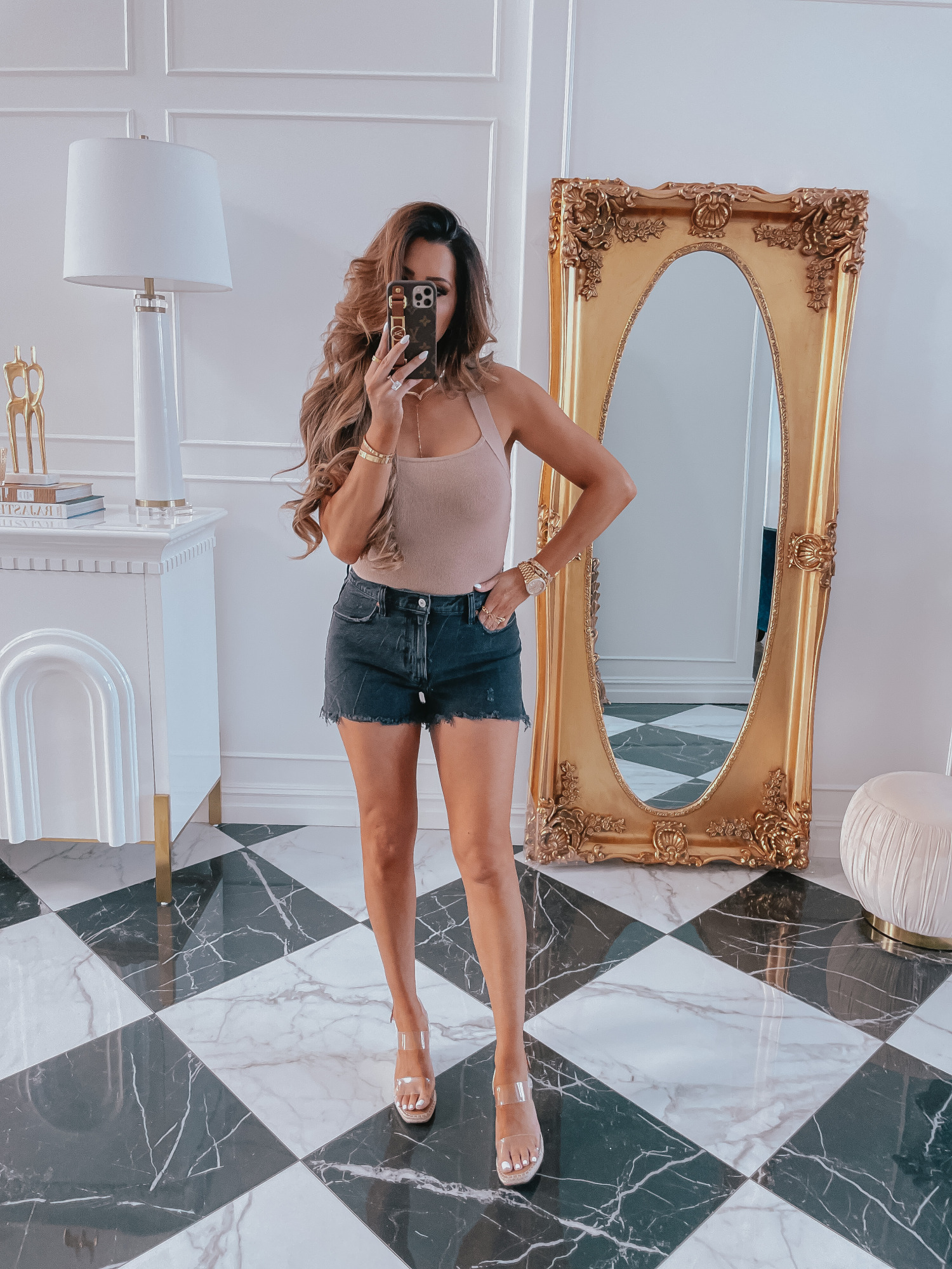 best Abercrombie shorts spring 2021, LTK day spring 2021, best high waisted denim shorts spring 2021, emily gemma2 |Best Sales This Weekend by popular US fashion blog, The Sweetest Thing: image of Emily Gemma wearing a nude bodysuit, black cutoff denim shorts, and clear strap platform espadrilles. 