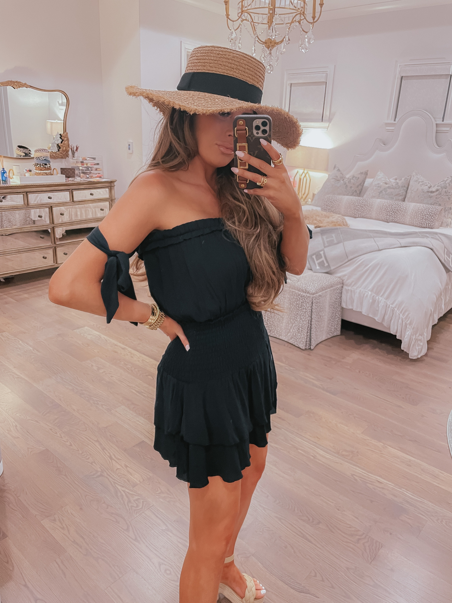 Vici Try On by popular US fashion blog, The Sweetest Thing: image of Emily Gemma wearing a black strapless Vici dress, straw sun hat, and nude block heel sandal.  