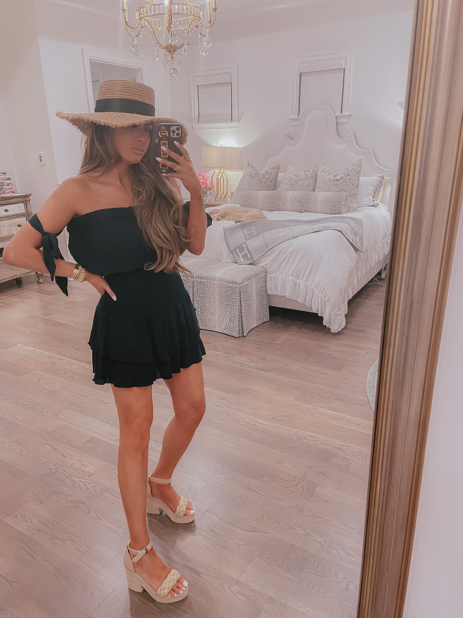 Vici Try On by popular US fashion blog, The Sweetest Thing: image of Emily Gemma wearing a black strapless Vici dress, straw sun hat, and nude block heel sandal.  