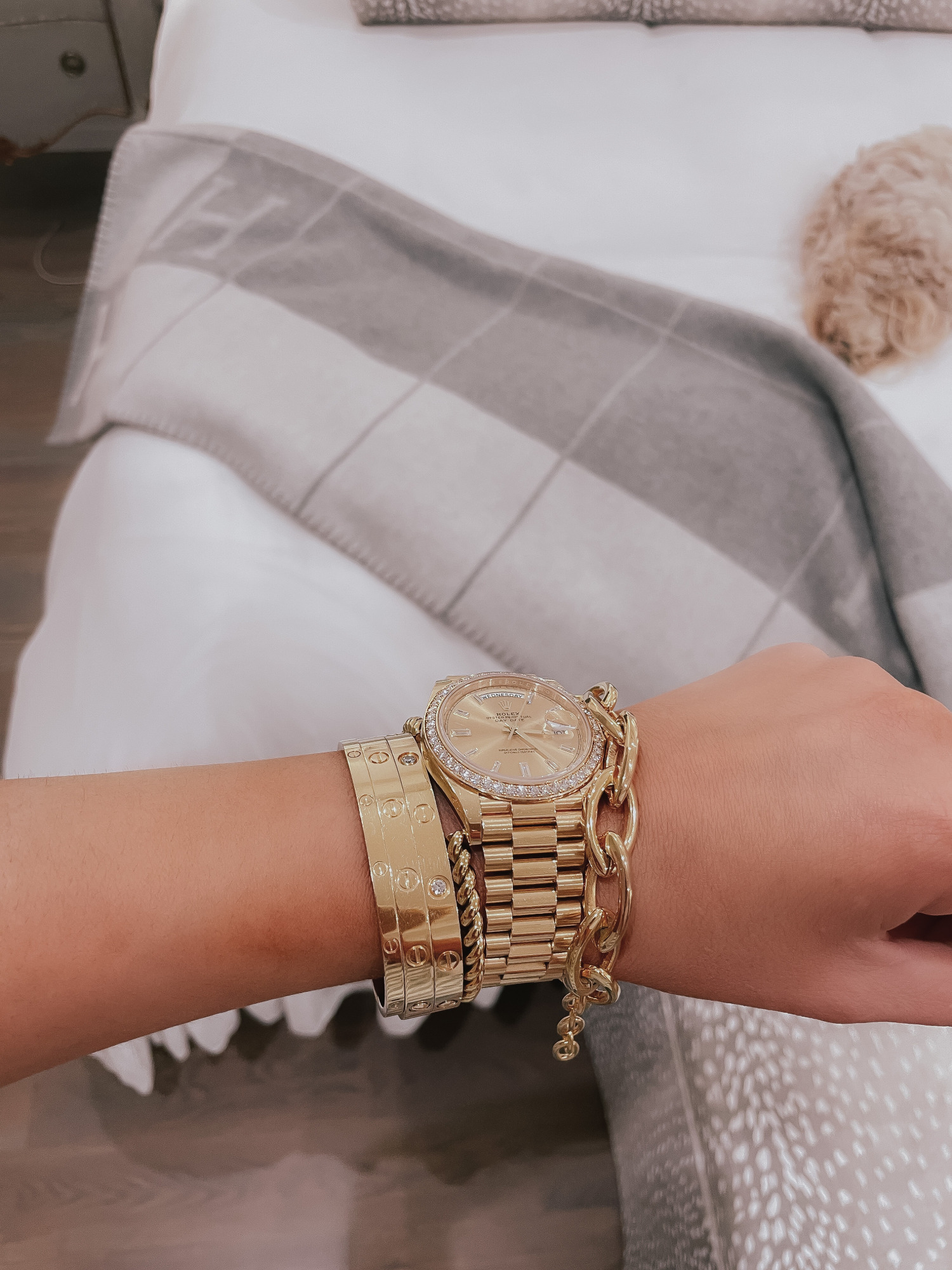 Vici Try On by popular US fashion blog, The Sweetest Thing: image of Emily Gemma wearing gold Cartier bracelets and a gold Rolex watch. 