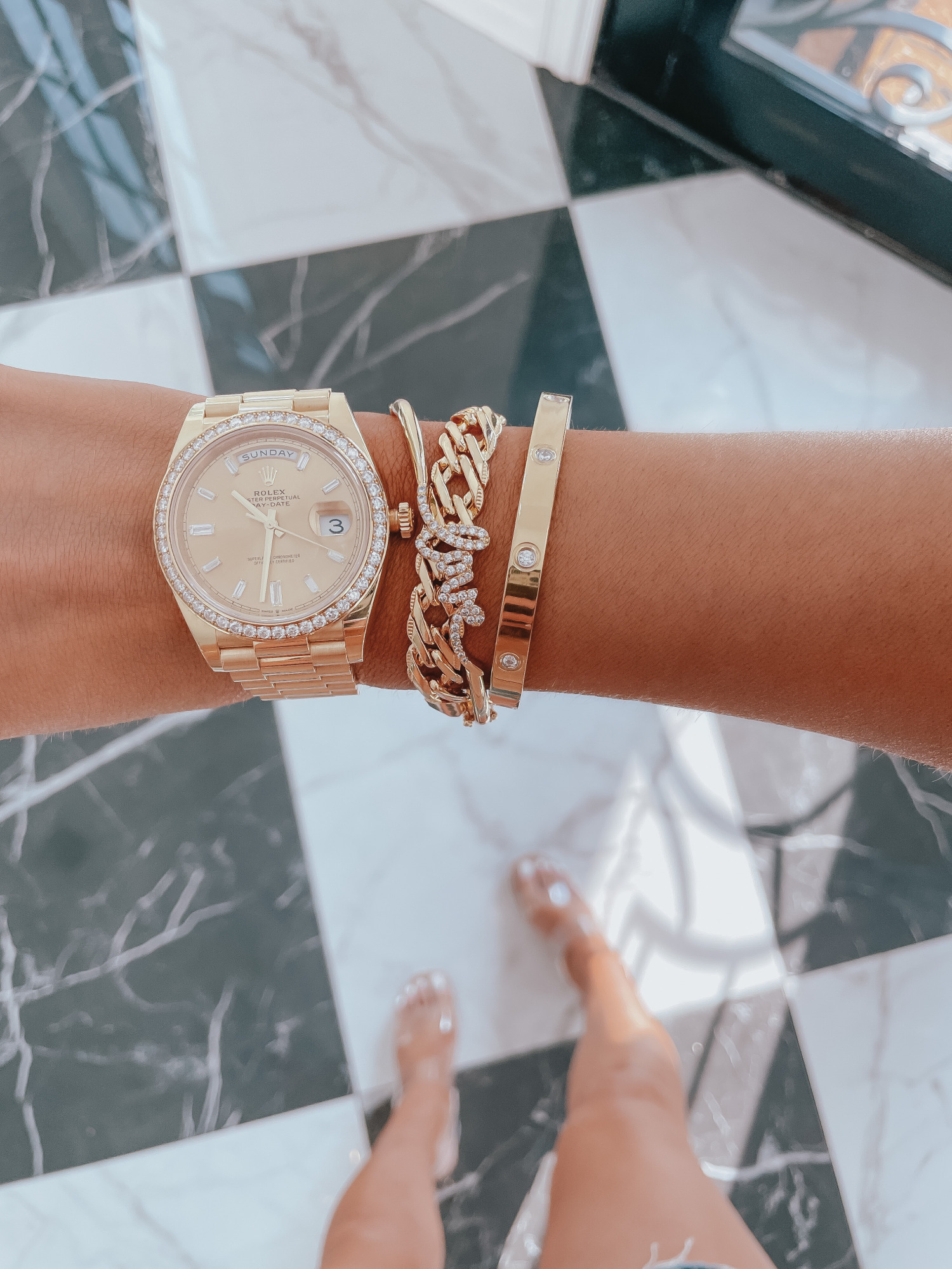 Rolex DayDate 40MM gold, LTK Day Sale Spring 2021, David Yurman Dupe bracelet, Lana Jewelry dupe, Emily gemma, the sweetest thing blog |Best Sales This Weekend by popular US fashion blog, The Sweetest Thing: image of Emily Gemma wearing a gold Rolex watch and told bracelets. 