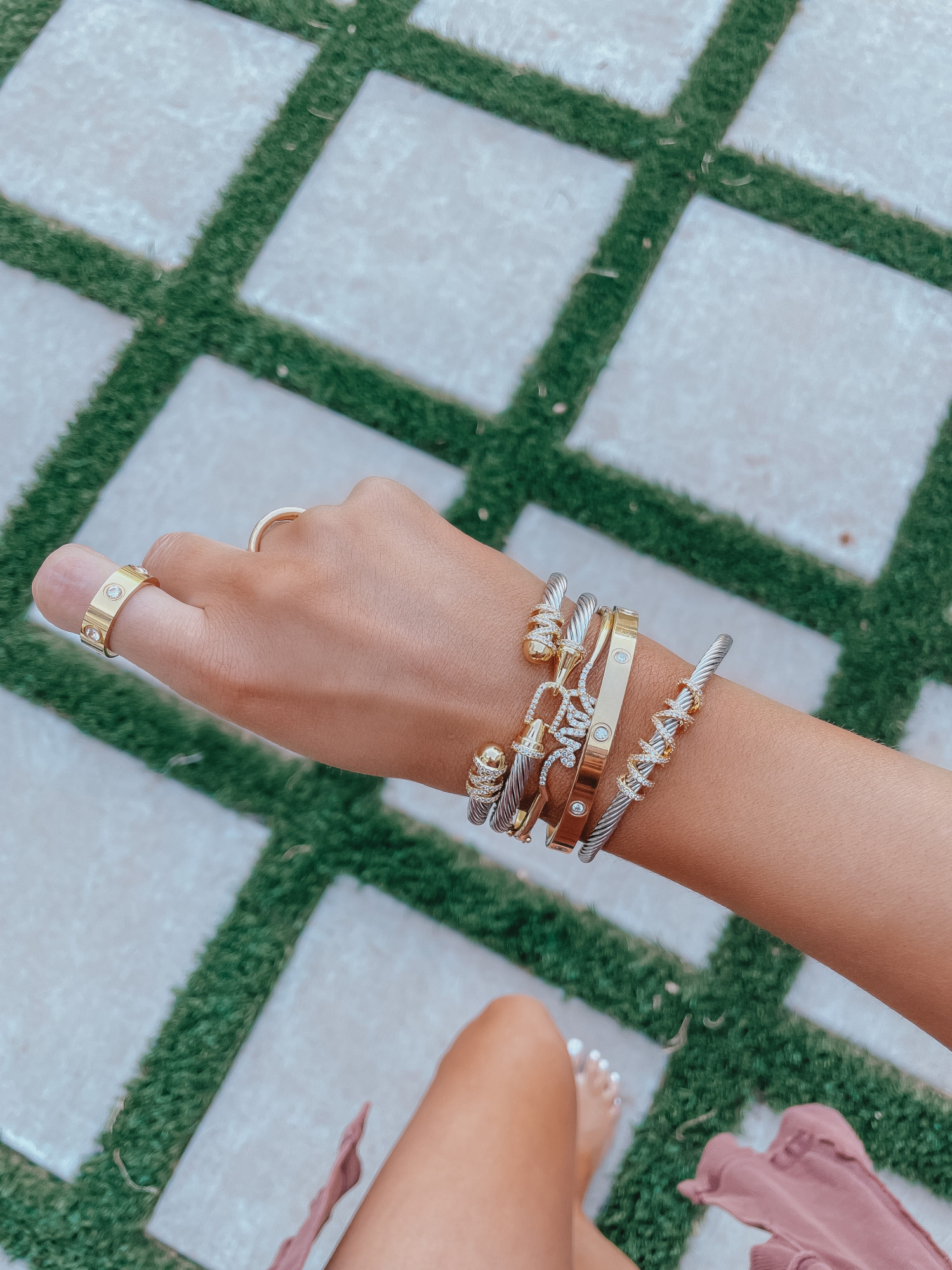 LTK Day Sale Spring 2021, David Yurman Dupe bracelet, Lana Jewelry dupe, emily gemma |Best Sales This Weekend by popular US fashion blog, The Sweetest Thing: image of Emily Gemma wearing gold and silver bracelets and a gold ring. 
