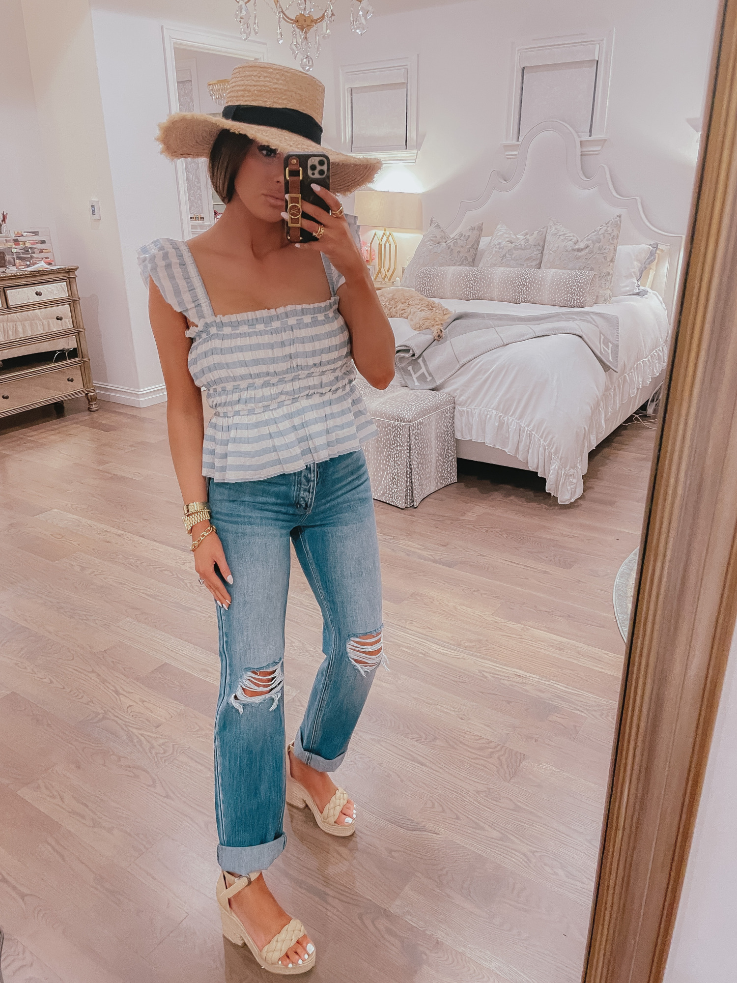 Vici Try On by popular US fashion blog, The Sweetest Thing: image of Emily Gemma wearing a Vici blue and white stripe peplum top, straw hat, and deconstructed jeans. 