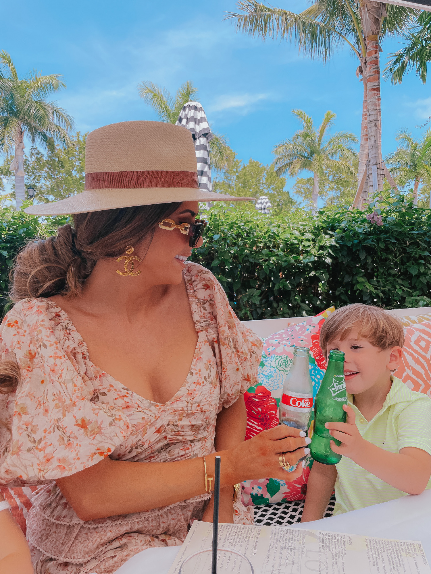 Palm beach white elephant lola41, Emily gemma | Lola 41 by popular US fashion blog, The Sweetest Thing: image of Emily Gemma and her daughter Sophie and son Luke sitting outside and eating food at Lola 41 while wearing Tularosa Shaylee dress, Paris Large Button Chanel Earrings, dior pink toile small book tote, Louis Vuitton Edge Sunglasses, chanel gold button earrings, Rag and Bone hat, Cartier bracelets, Janie and Jack white tank top, and Vineyard Vines polo shirt.  