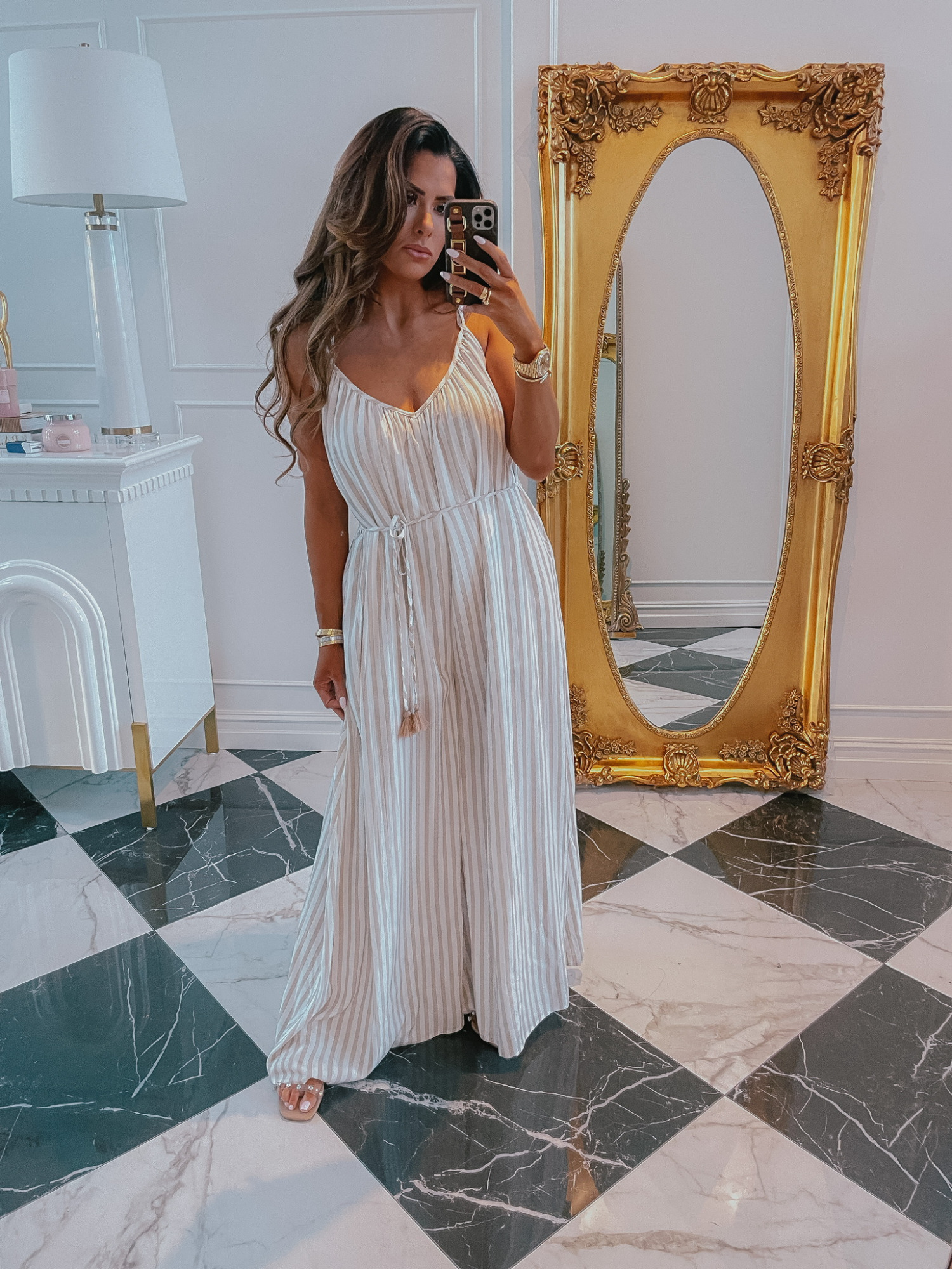 Red Dress try on haul, white jumpsuit, summer outfit ideas, romper, jumpsuit, Emily ann gemma | Instagram Recap by popular US life and style blog, The Sweetest Thing: image of wearing a white and tan stripe jumper and gold jewelry and holding a smartphone in a Louis Vuitton case. 