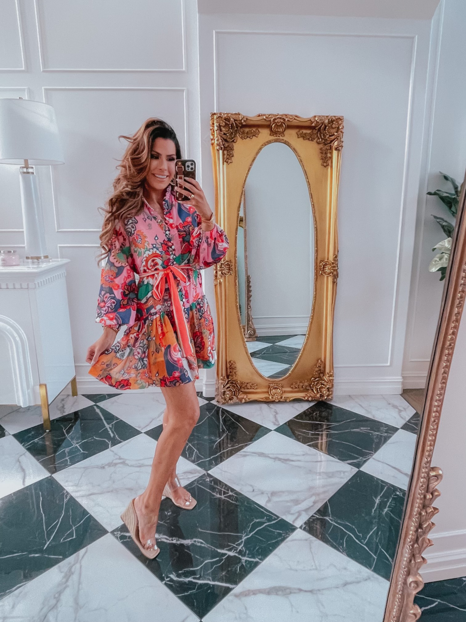 Red Dress Try On Haul, Emily Ann Gemma, Clear Wedges, Zimmermann dupe dress, colorful summer dress ideas, bright floral swing dress | June Instagram Recap by popular US fashion blog, The Sweetest Thing: image of Emily Gemma wearing a bright floral print dress and clear strap espadrilles. 