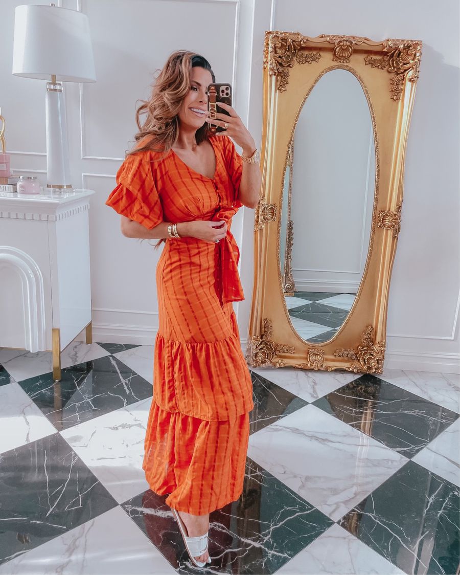 Red Dress Try On Haul, Best Summer Dresses 2021, white and gold summer slide sandals, affordable slide sandals, orange dress, summer date night dress, Emily ann gemma | June Instagram Recap by popular US fashion blog, The Sweetest Thing: image of Emily Gemma wearing an orange plaid maxi dress with white sandals. 