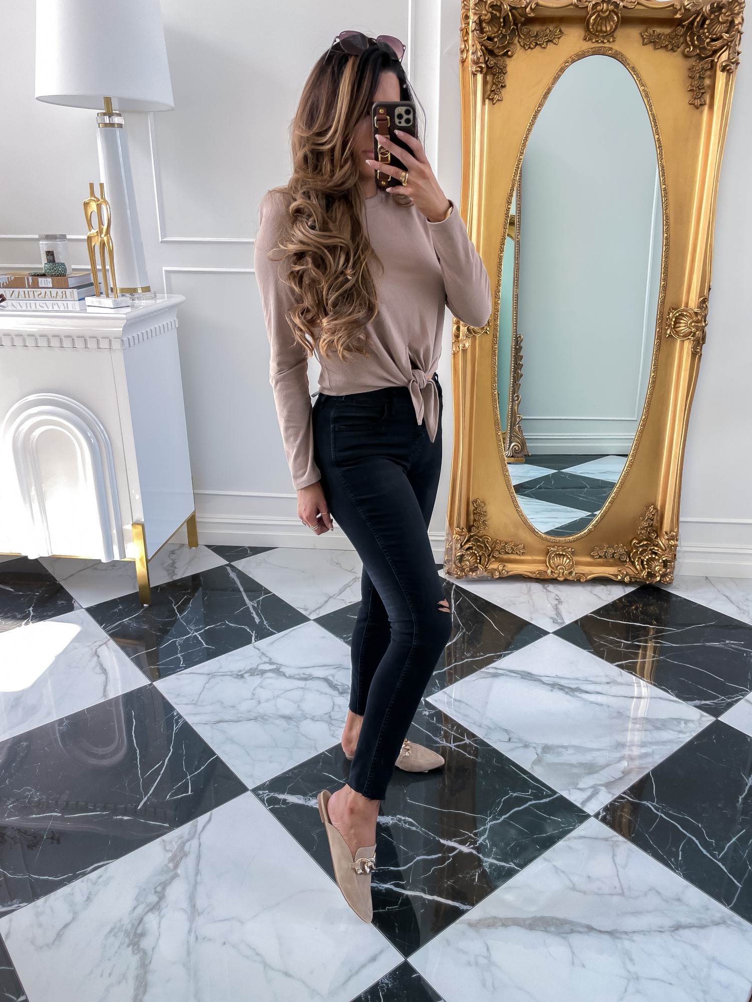 nordstrom sale 2021 must haves, Good american NSALE 2021, Emily gemma | Nordstrom Anniversary Sale by popular US fashion blog, The Sweetest Thing: image of Emily Gemma wearing a brown long sleeve tie front shirt, black leggings, and Steve Madden gold chain tan brown suede mules. 