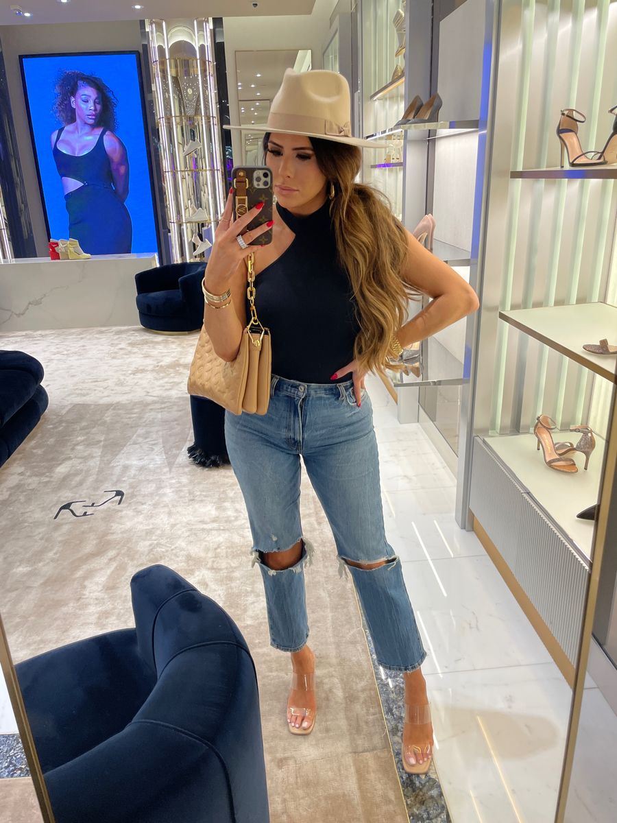 Emily ann gemma, shopping outfit, jeans, hat, black bodysuit, what to wear on a shopping trip, best handbags, fall hat |  Instagram Recap by popular US life and style blog, The Sweetest Thing: image of Emily Gemma wearing a black mock neck tank, distressed jeans, clear strap sandals, tan felt rancher hat, and tan quilted purse. 