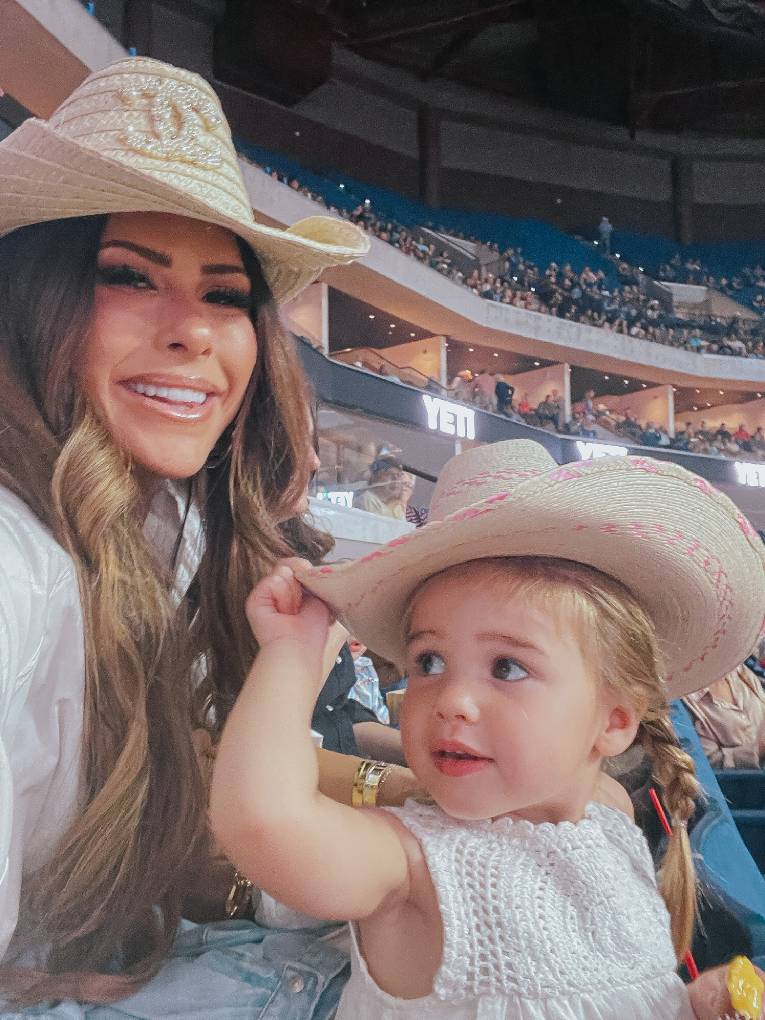 Emily Ann Gemma, Sophia Gemma, Cowgirl Boots, What To Wear To The Rodeo, Western Outfit Ideas, Amazon Cowgirl Boots, Fendi Cowboy Boot Dupes, Louis Vuitton Handbag, Cowgirl Hat, Chanel Cowboy Hat | Instagram Recap by popular US life and style blog, The Sweetest Thing: image of Emily Gemma and her daughter wearing white dress and tan straw cowboy hats. 