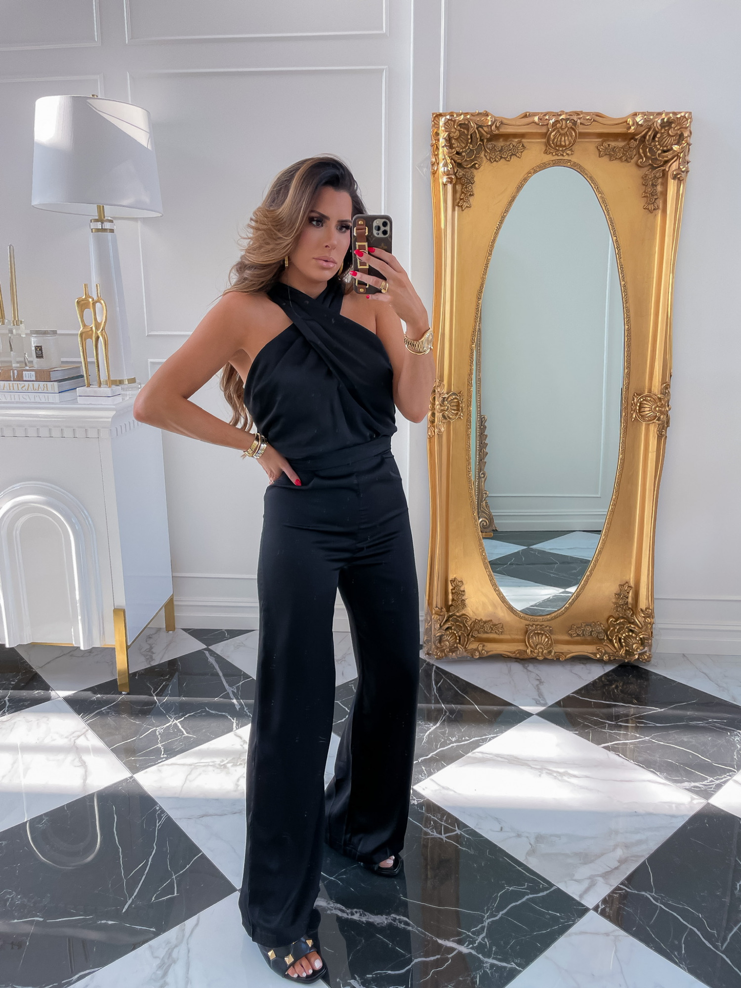 Red Dress Try On Haul, Fall Dresses, Fall Outfit Ideas, Wedding Guest Looks, Emily Ann Gemma, Pre-Fall Transitional Outfit Ideas | Fall Outfits by popular US fashion blog, The Sweetest Thing: image of Emily Gemma wearing a black Red Dress jumpsuit with black gold studded sandals. 