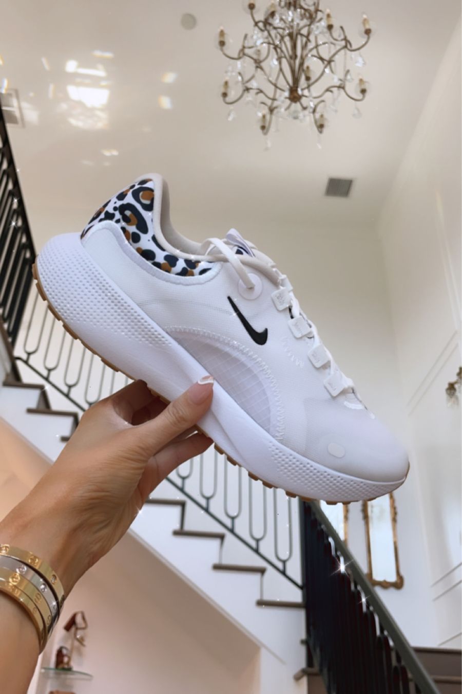 Nike Sneakers, Leopard Print Sneakers, White Sneakers, White Tennis Shoes, Nordstrom Sale Women's Shoes, Emily Ann Gemma | Instagram Recap by popular US life and style blog, The Sweetest Thing: image of Emily Gemma holding a white leopard print Nike sneaker. 