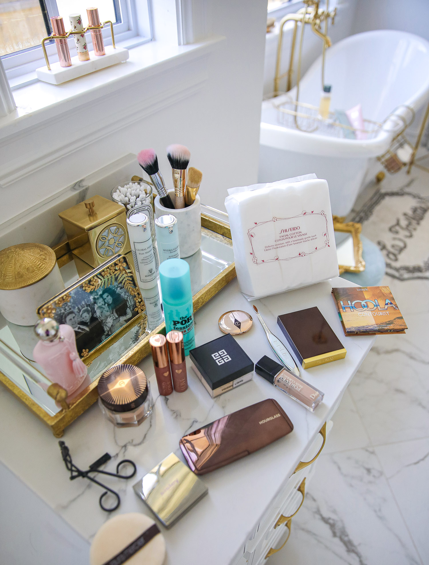 nordstrom beauty must haves fall 2021, sisley pore minimizer review, sisley blur powder review, sisley hyaluronic acid, emily gemma beauty must haves, hoola bronzer palette |  Beauty Favorites by popular US beauty blog, The Sweetest Thing: image of various beauty products spread across a white marble vanity top. 