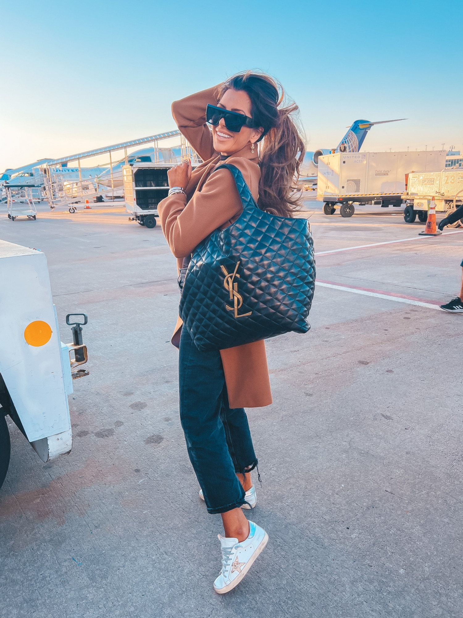 Saint Laurent ICare Extra Large Embellished Quilted Leather Tote, Celine 60mm Flat Top Sunglasses, Emily Gemma Airport Outfit, Travel Fashion 2022