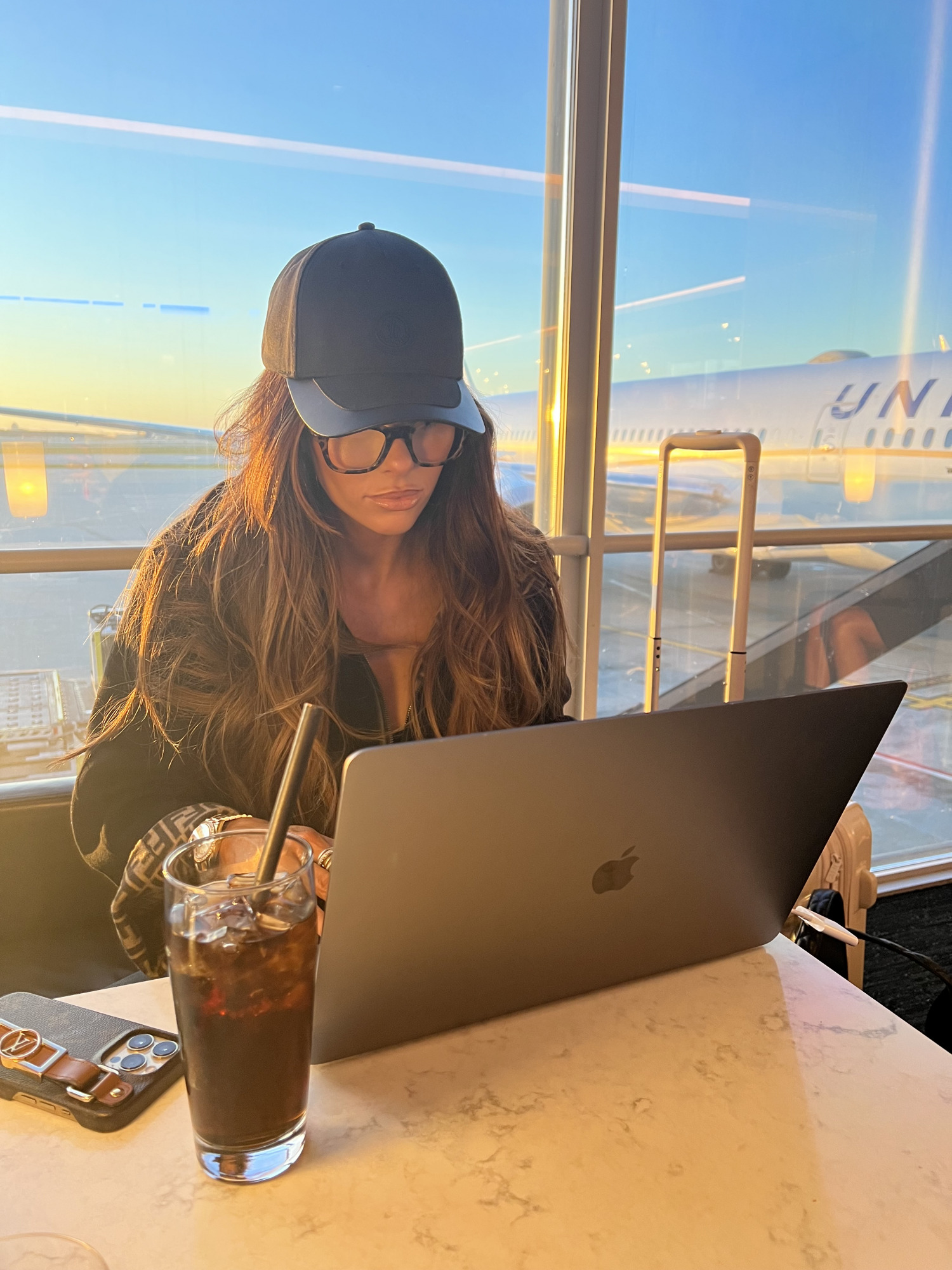 united Polaris lounge first class 1k Chicago international, Emily Gemma travel