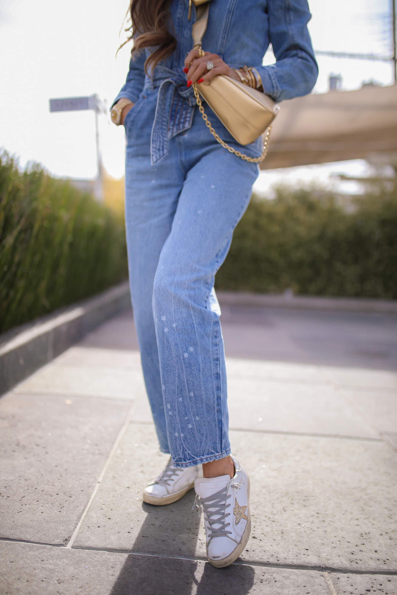 express denim jumpsuit, golden goose sneaker outfit idea, prada gold triangle bag, emily ann gemma3