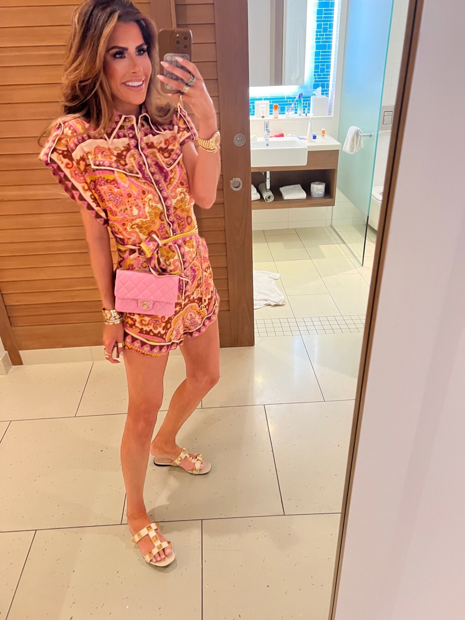 Chanel Pink Crossbody Quilted Bag, Valentino Roman T-Strap Slide Sandal, Zimmermann Halycon Playsuit, Emily Gemma