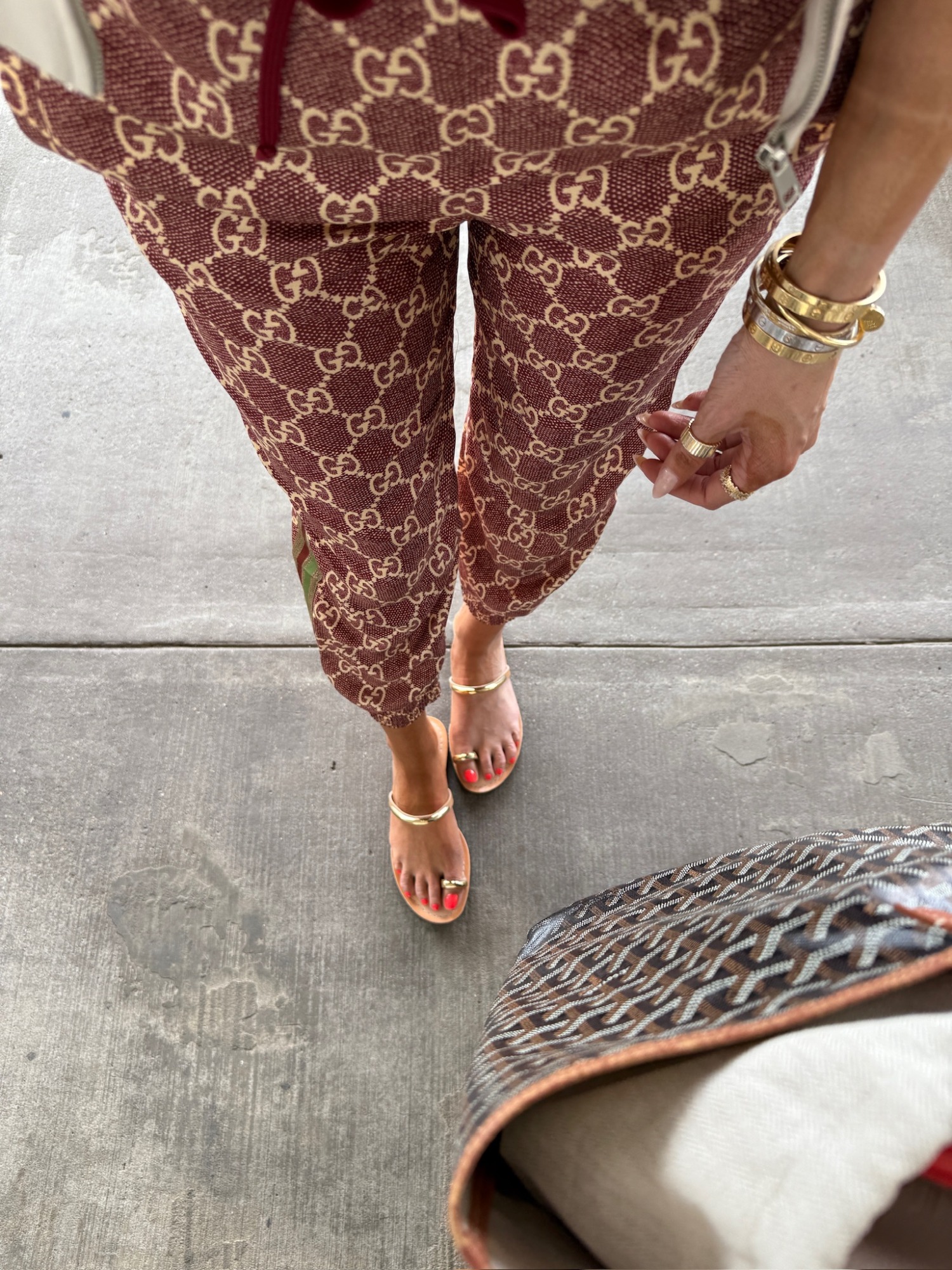 Gucci pants, travel outfit, travel bag, goyard bag, travel tote, dolce vita, spring sandals, summer sandals, Emily Ann Gemma, Goyard St. Louis pm, airport outfit, airport outfit, airport travel style